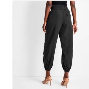 future collective nylon track stripe joggers